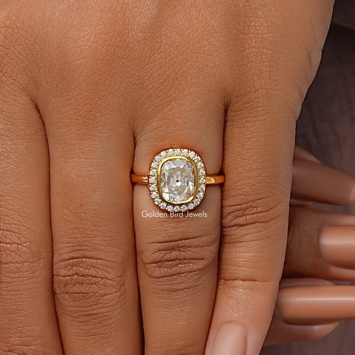 Cushion old mine cut halo moissanite ring on finger