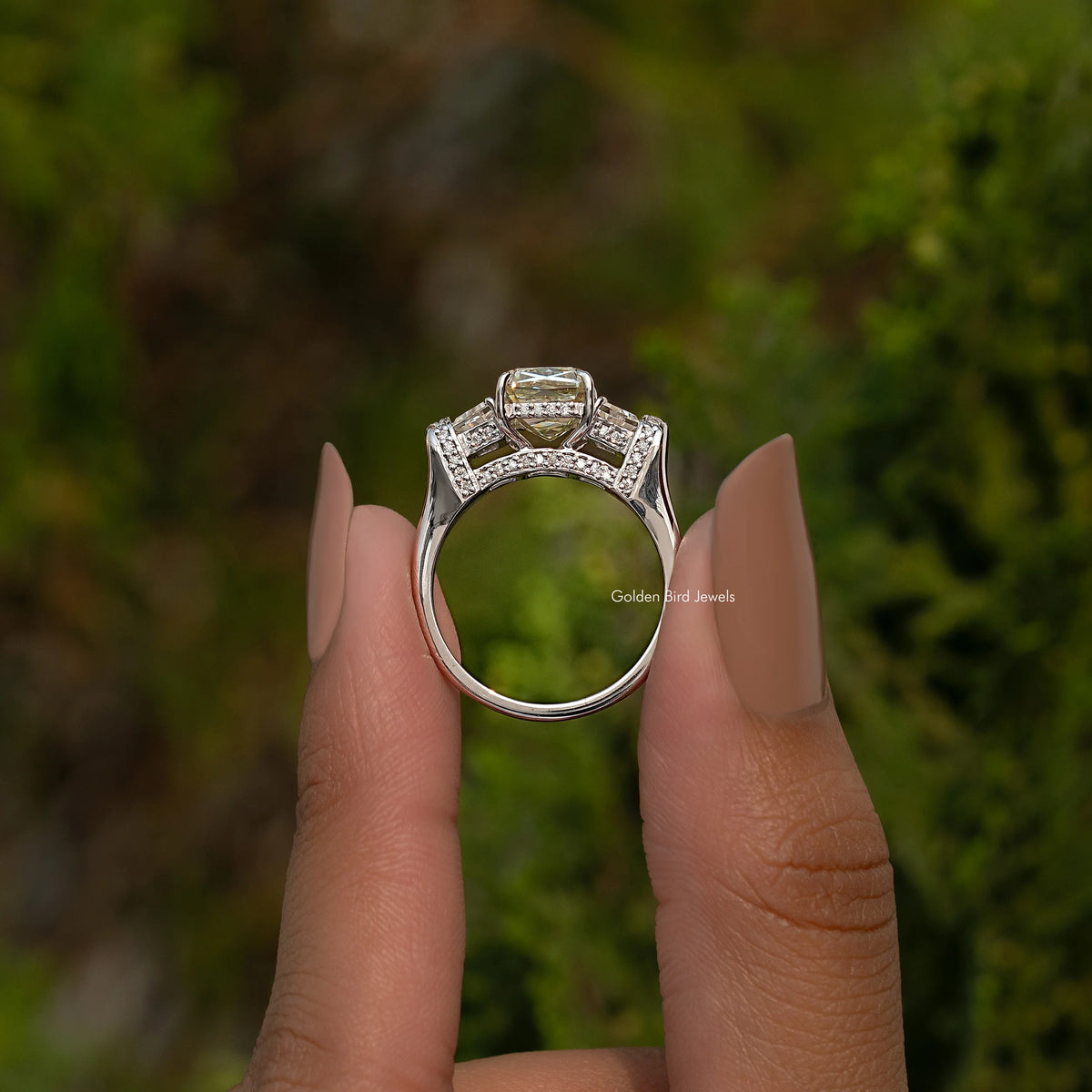 Sterling silver three-stone engagement ring with prong-set center stone and side stones