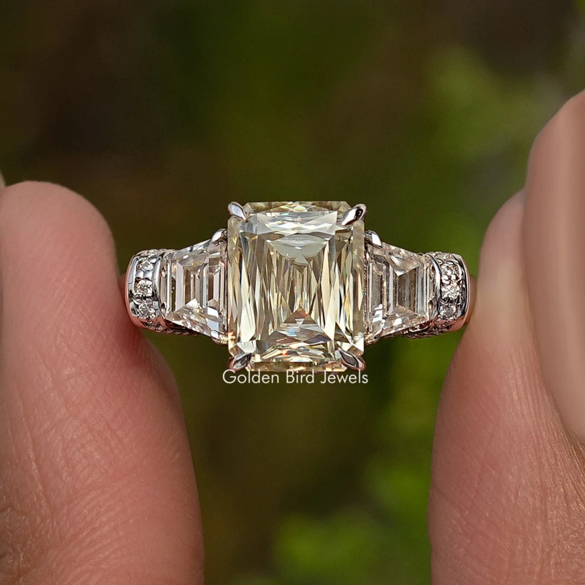 Sterling silver three-stone engagement ring with large center square-cut stone