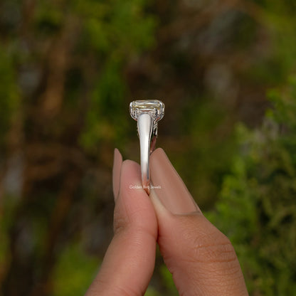 Sterling silver three-stone ring with tall prongs holding square center stone