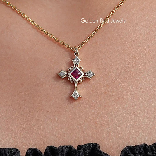 Gold chain gemstone cross pendant with square red center and prong-set side stones
