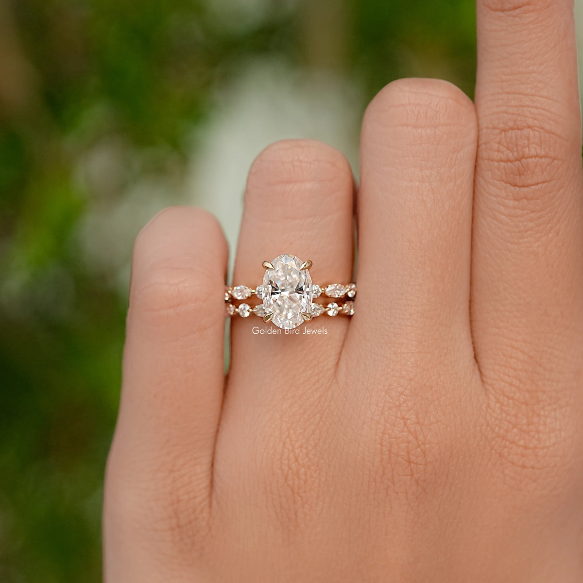 Oval cut moissanite bridal ring set with a central stone and matching band