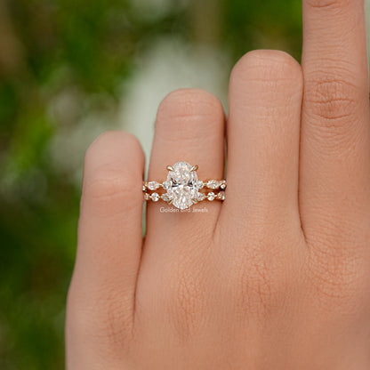 Oval cut moissanite bridal ring set with a central stone and matching band