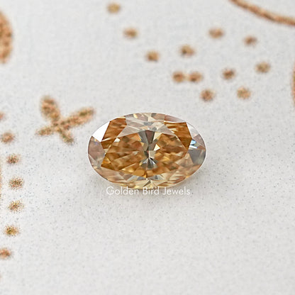 Oval loose moissanite gemstone, warm golden-brown facets