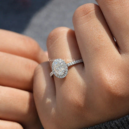 Oval moissanite halo accent ring with slim pavé band