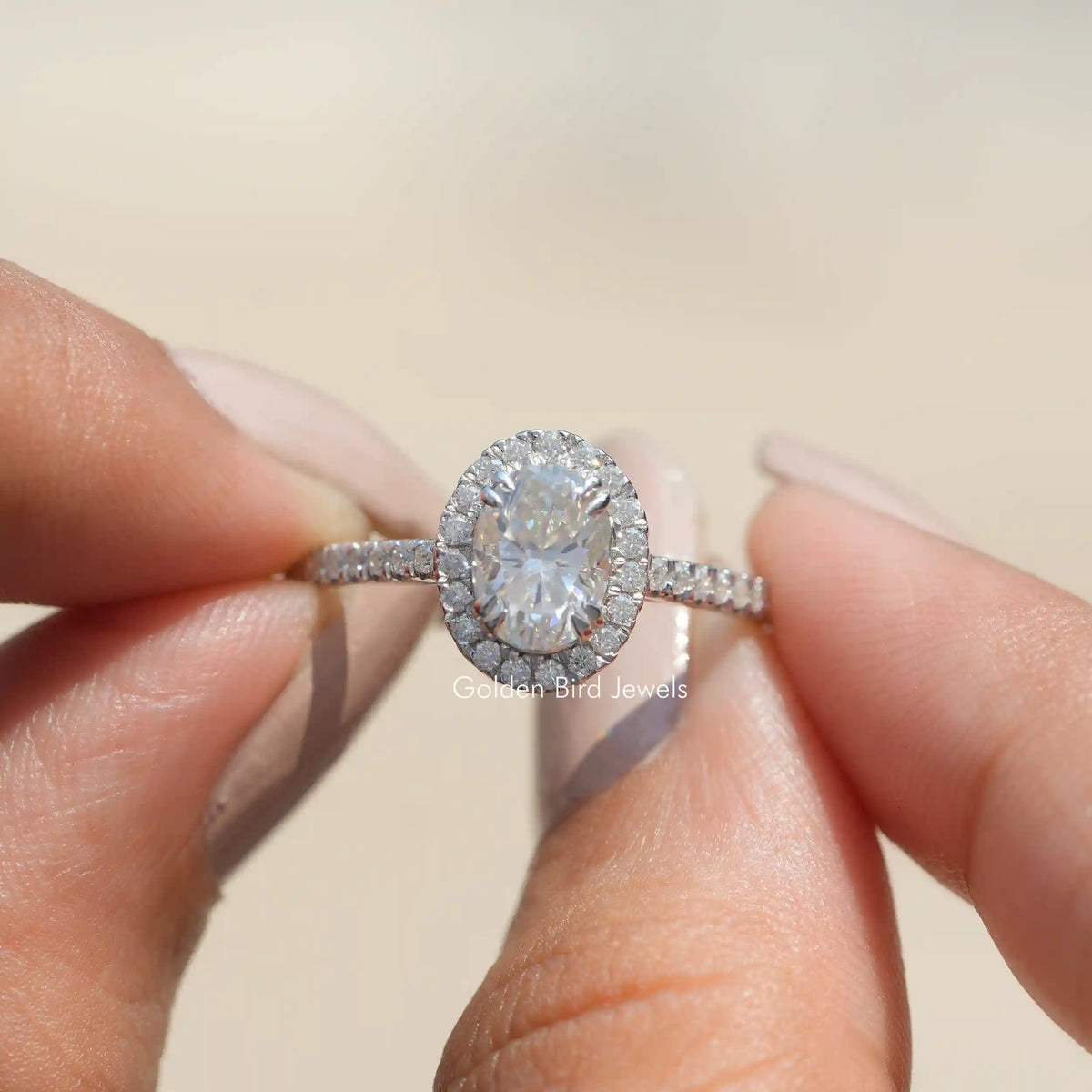 Oval moissanite halo ring with pavé band