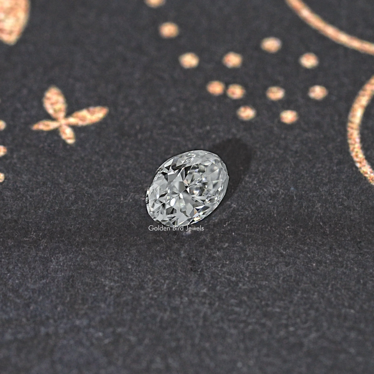 Oval clear moissanite gemstone, close-up view of faceted top and brilliance