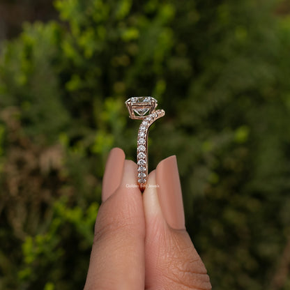 Curved accent engagement ring with round-cut center stone and pavé band