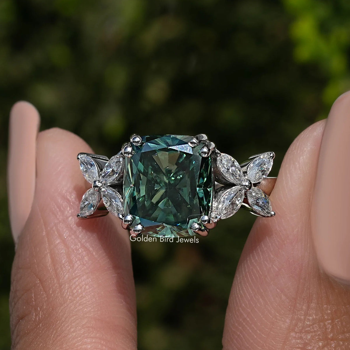 925 sterling silver cushion-cut moissanite ring with green center and marquise accents