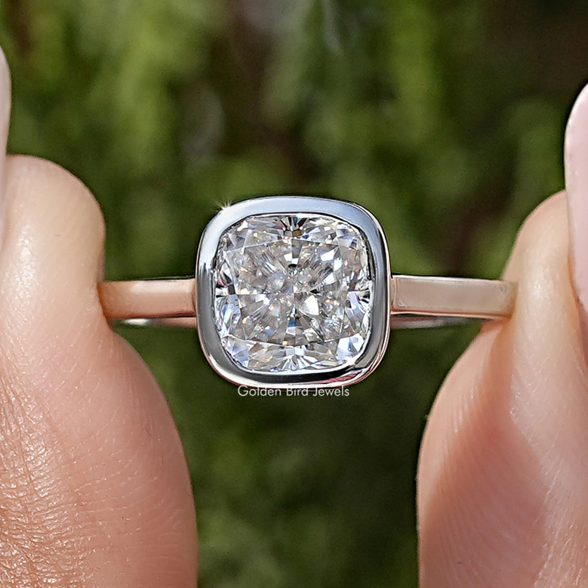 Close-up cushion-cut moissanite in bezel setting on 925 sterling silver promise ring