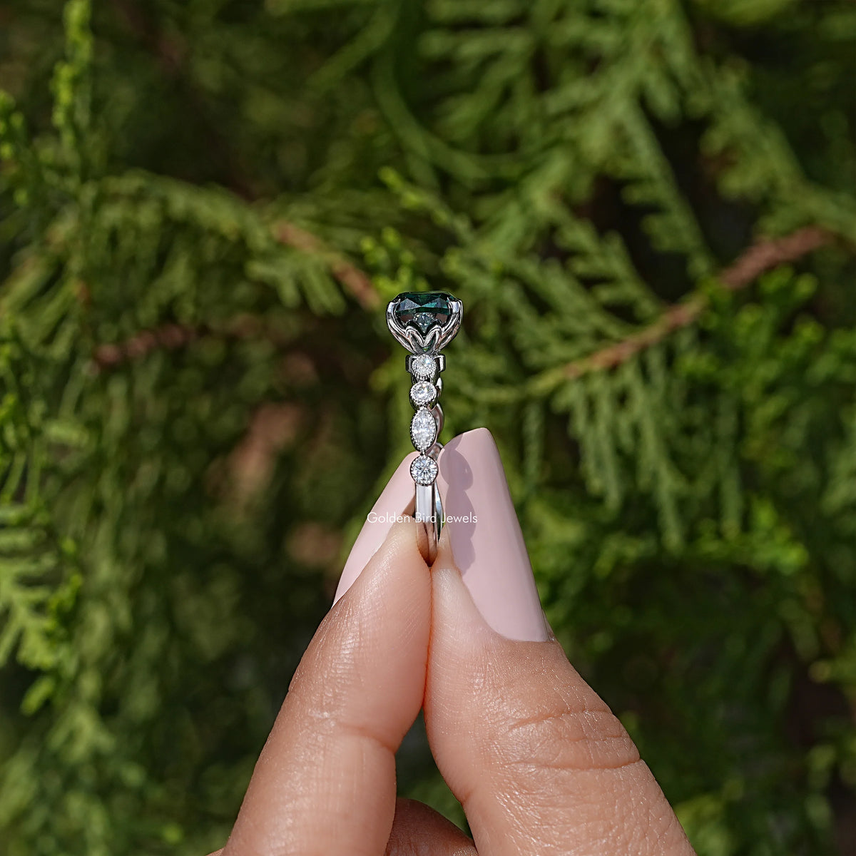 925 sterling silver moissanite engagement ring with cushion-cut teal center, prongs, and diamond accents