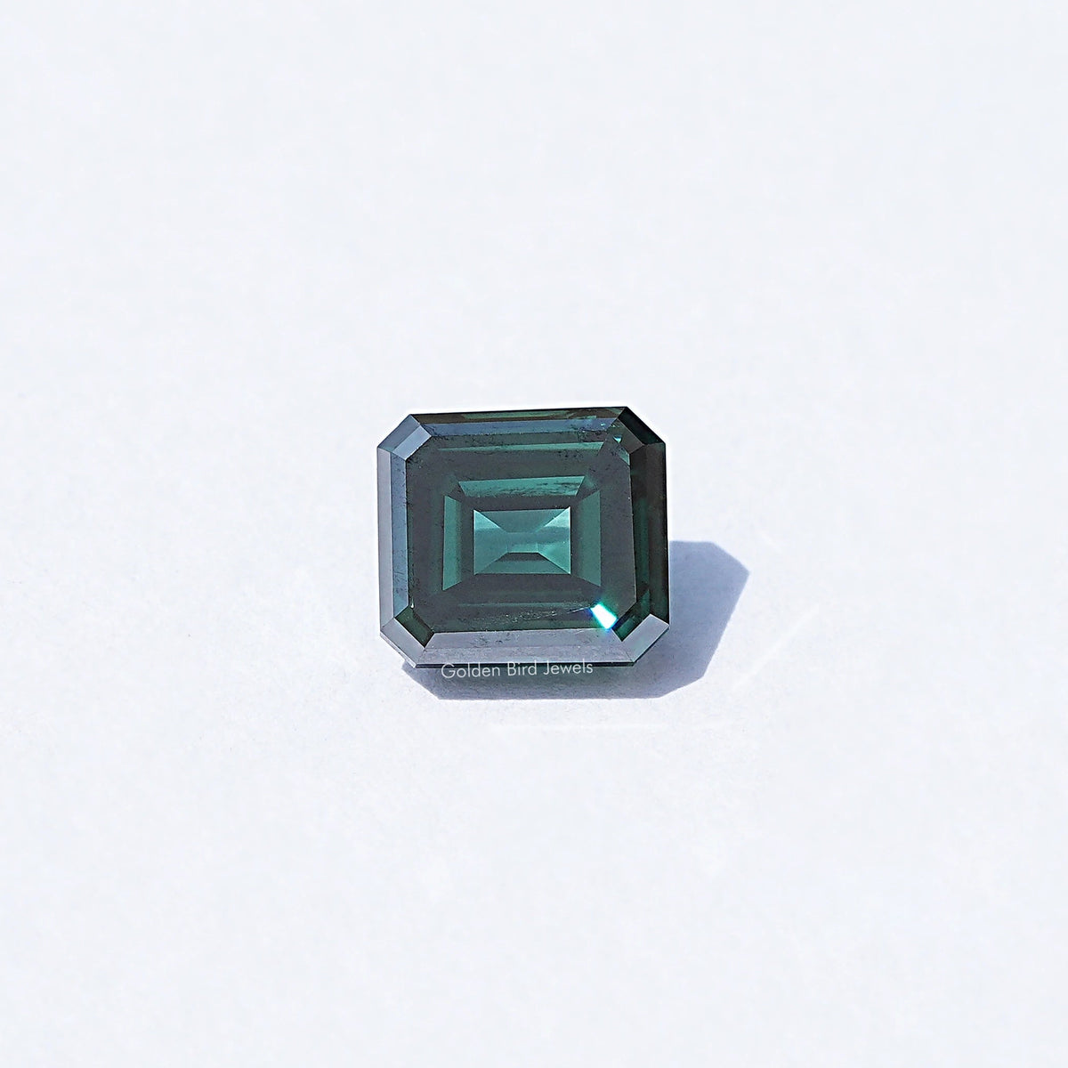 Loose dark green Asscher-cut moissanite gemstone, square step facets