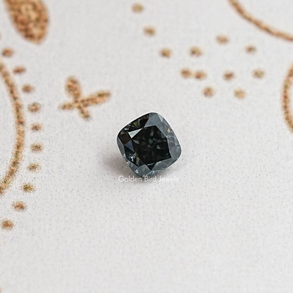 Cushion-cut moissanite gemstone, dark gray/black with sparkling facets