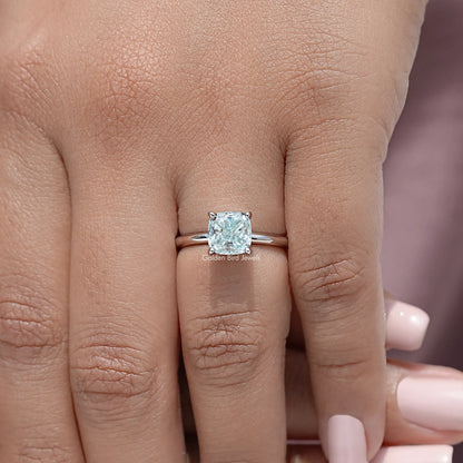 Sterling silver cushion-cut moissanite solitaire ring on fingers, close-up