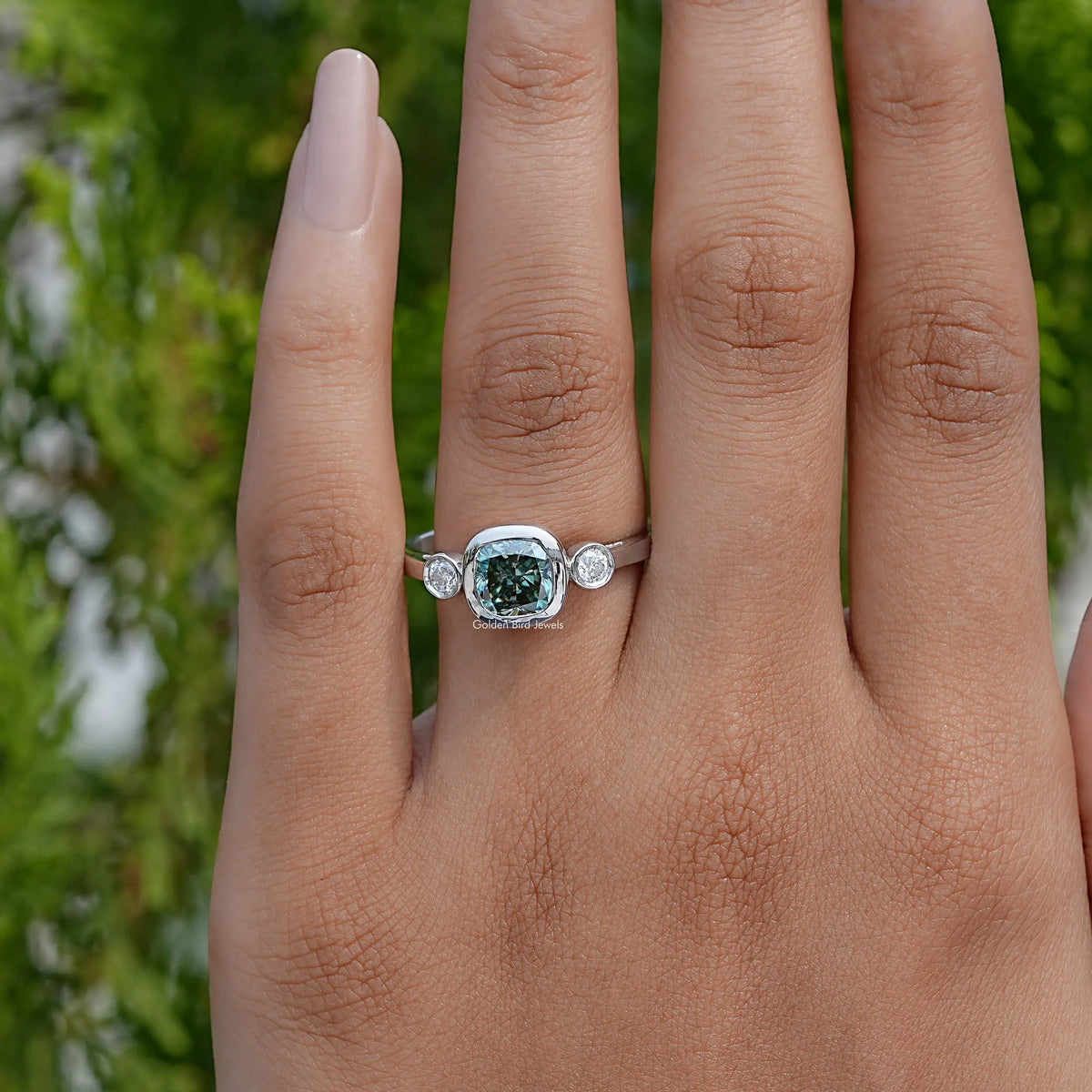 Three-stone cushion-cut moissanite ring with round side stones, silver band