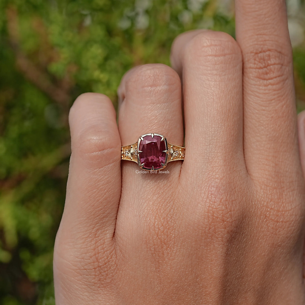 Cushion-cut alexandrite ring with purple center stone and pavé accent band