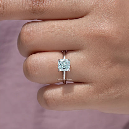 Sterling silver cushion-cut moissanite solitaire ring on hand, side profile