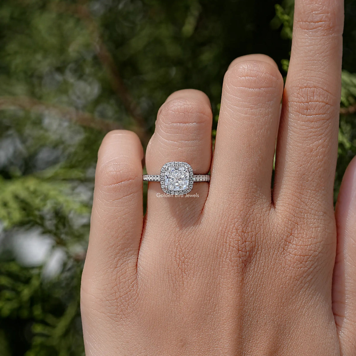 Sterling silver cushion-cut moissanite solitaire ring with thin halo band