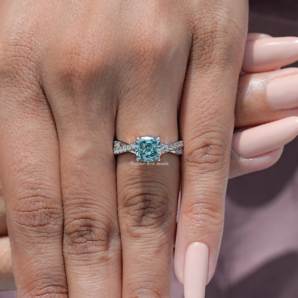 925 sterling silver moissanite engagement ring with twisted band and blue cushion center