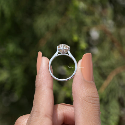 Back view of rose-gold tone elongated cushion-cut solitaire engagement ring