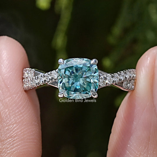 Cushion moissanite engagement ring with twisted silver band