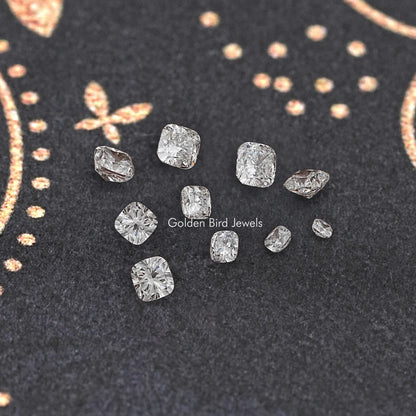 Cushion-cut lab-grown diamonds scattered display, small square/round facet shapes