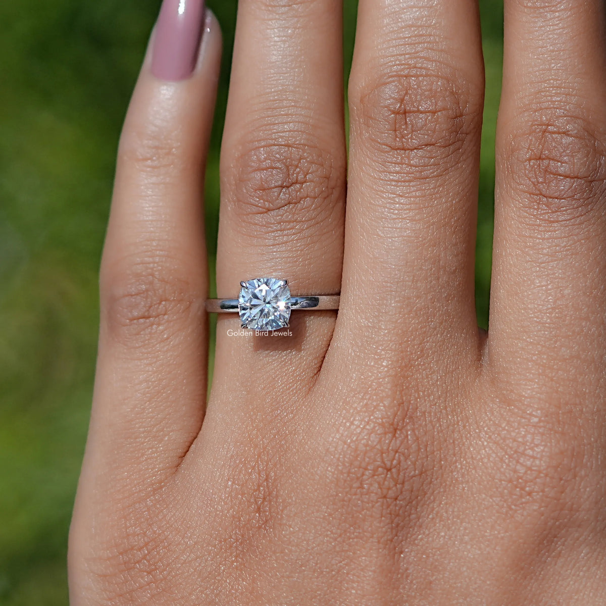 In finger view of Cushion Cut Moissanite Solitaire Ring