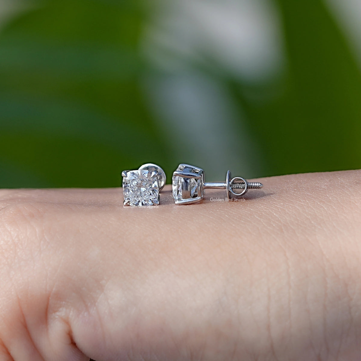 Diamond solitaire stud earrings with square prong setting and post backs