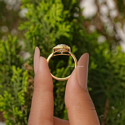 Gold-tone ring open back view with structured shank and halo top