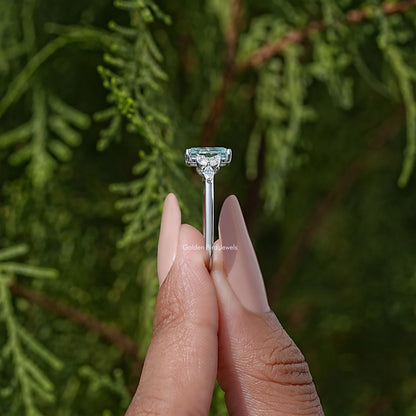 Sterling silver engagement ring with cushion-cut blue-green moissanite prong setting