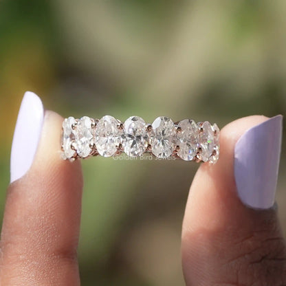 Oval-cut moissanite 3/4 eternity band ring with prong-set stones on fingers