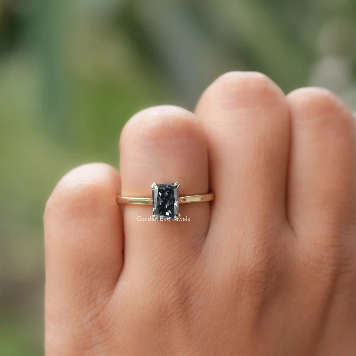 In finger front view of Dark Gray Moissanite Engagement Ring 