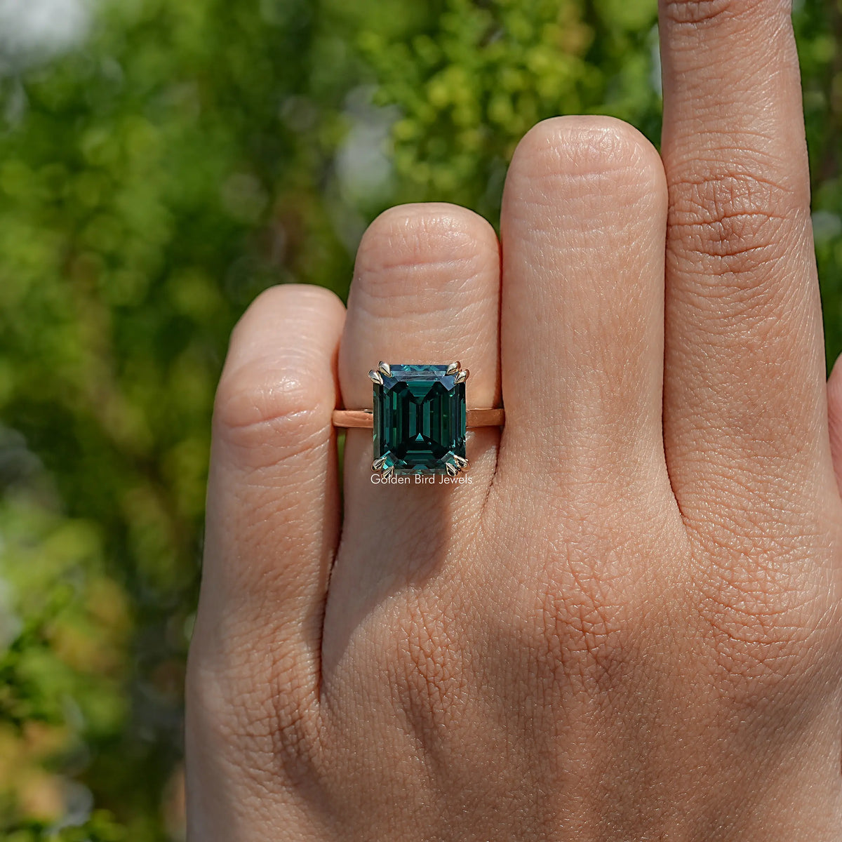 Top View Of Dark Green Emerald Cut Moissanite Engagement Ring