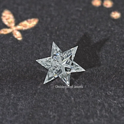 Star-cut loose lab-grown diamond, sparkling faceted star close-up