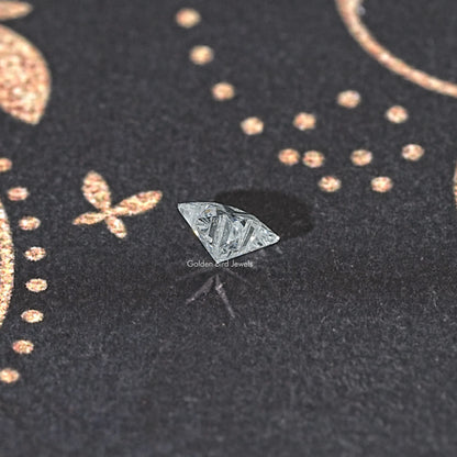 Star-cut loose lab-grown diamond, tilted view of faceted star shape
