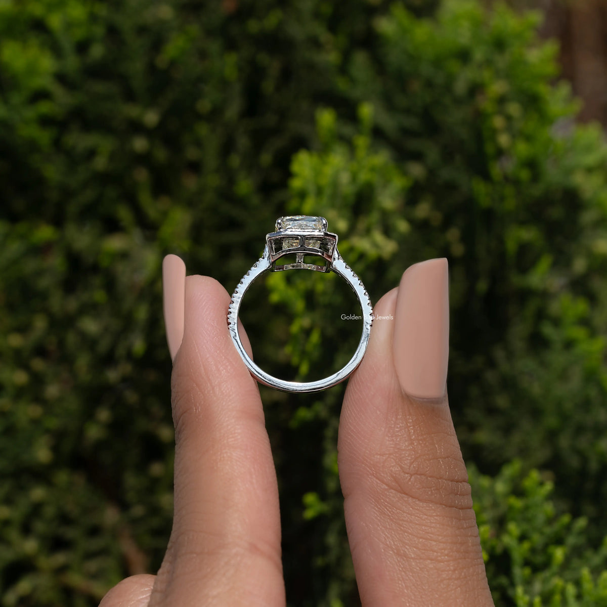 Sterling silver moissanite halo engagement ring side view, prong-set center stone