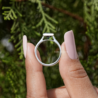Oval moissanite solitaire ring underside view, teal bezel in sterling silver