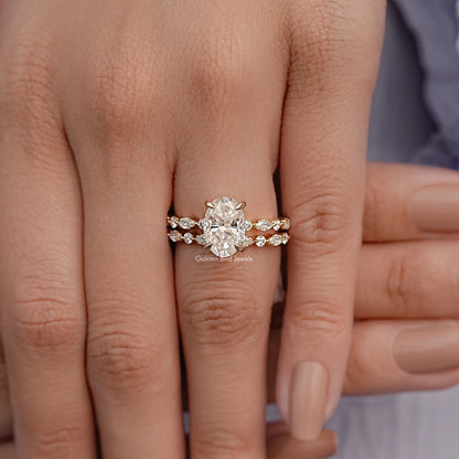 Moissanite bridal ring set with oval center stone and matching pave bands