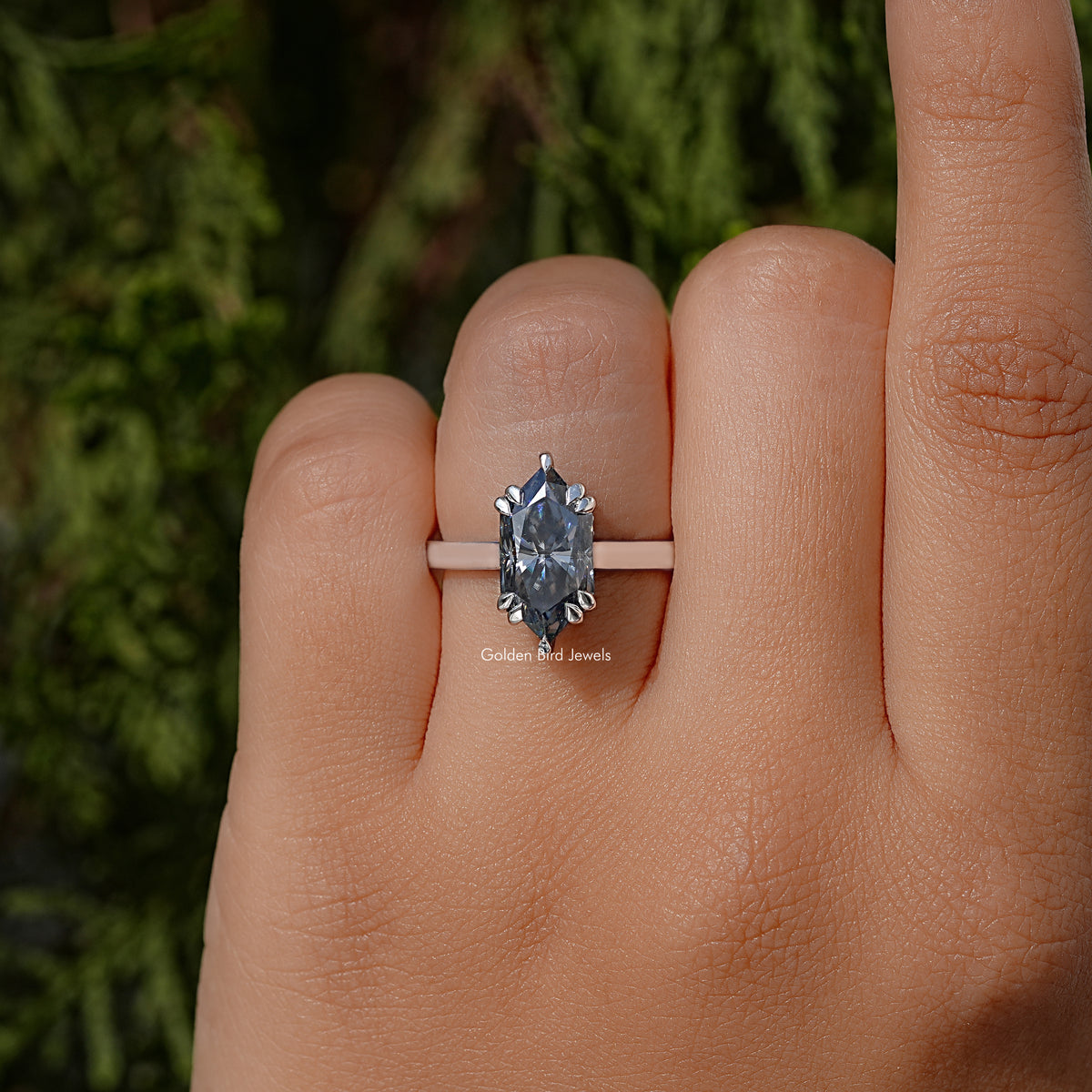 Marquise moissanite solitaire ring, silver band with large center stone on finger