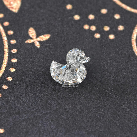 Duck-cut lab-grown diamond with stepped sparkle, centered on dark display