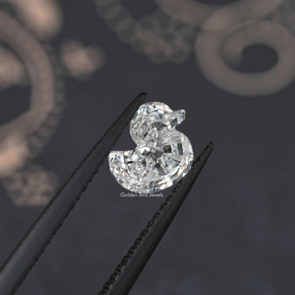 Duck-cut lab-grown diamond, multi-faceted sparkle, pointed ends, angled view