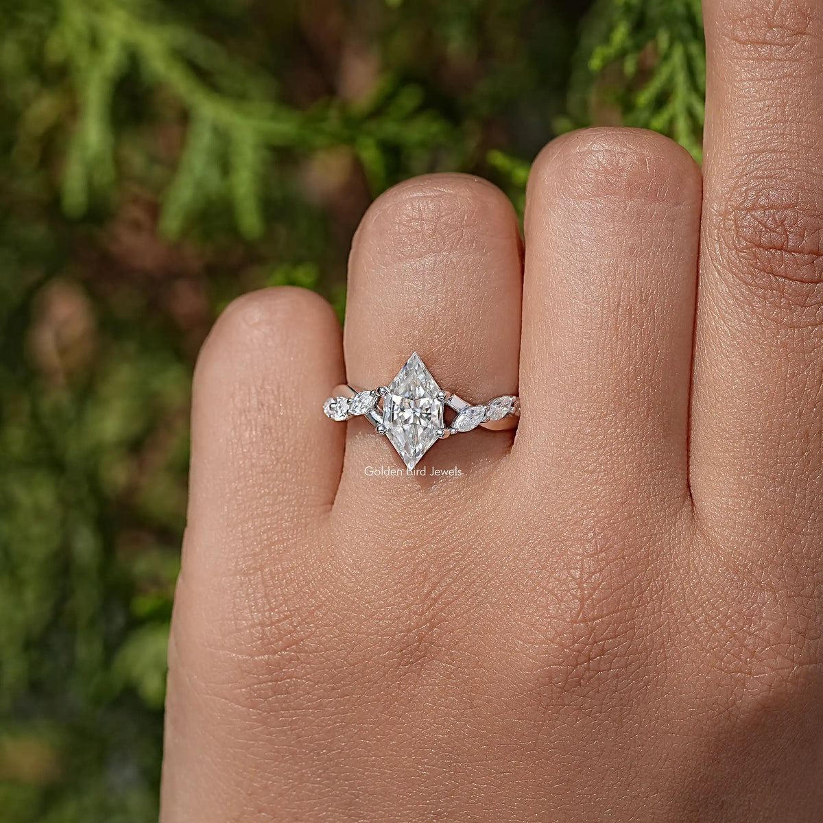 Sterling silver floral wedding ring with marquise-cut moissanite center stone