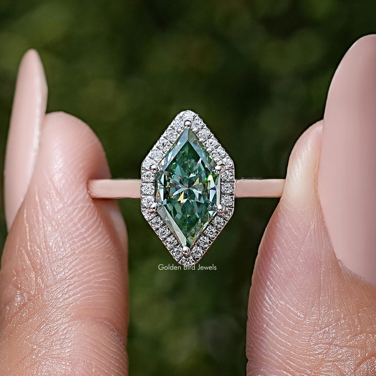Sterling silver marquise moissanite halo wedding ring close-up, green center with halo