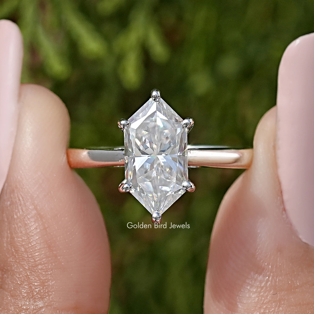 Sterling silver marquise moissanite solitaire ring with marquise center stone, four-prong setting