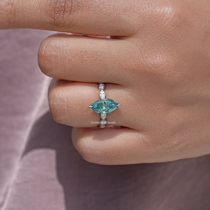 925 sterling silver ring close-up with teal marquise center and small round stones