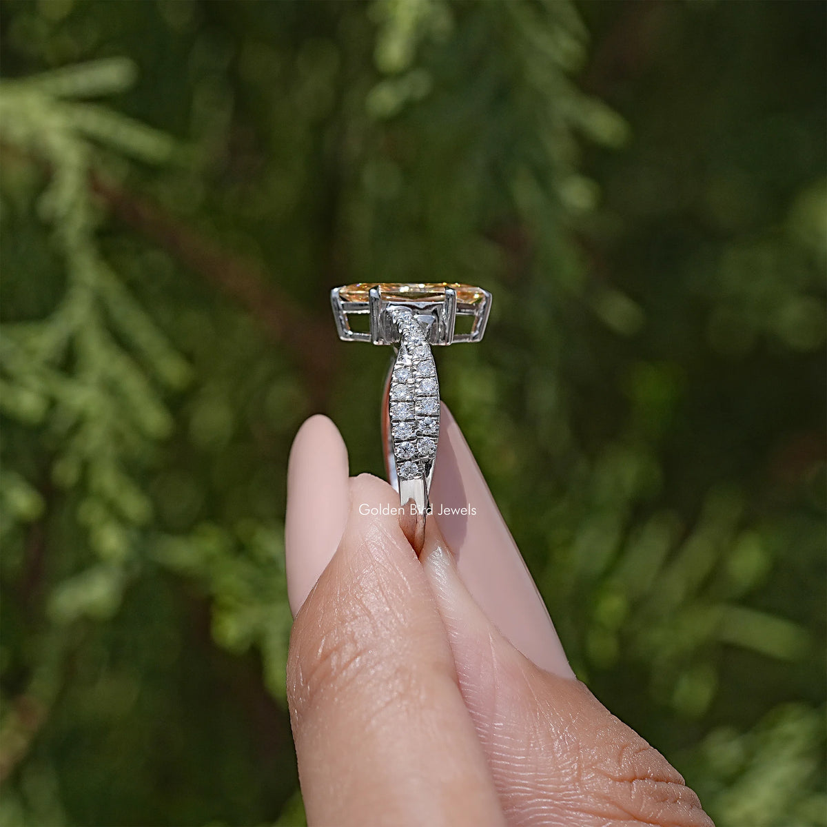 Sterling silver marquise moissanite ring with twisted pavé shank