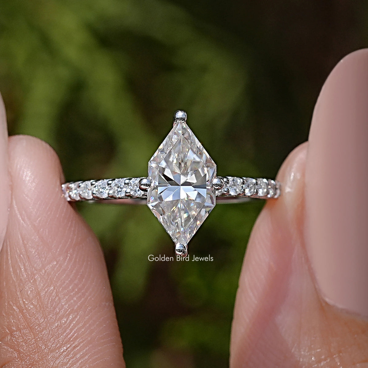 Marquise moissanite solitaire engagement ring with pave band