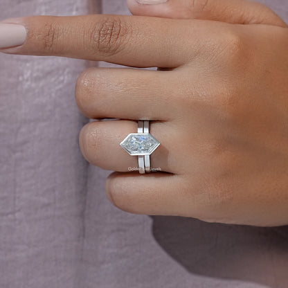 Silver-tone marquise bezel ring set close-up with faceted center stone