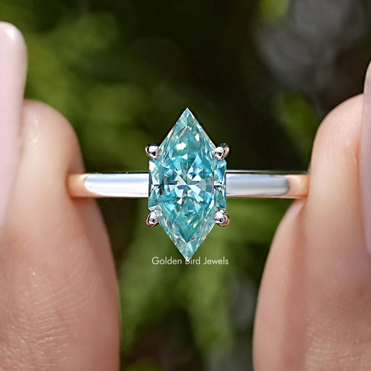 Close-up of 925 sterling silver marquise moissanite solitaire ring, light-blue center