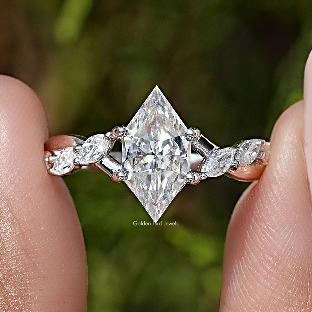Close-up of sterling silver floral ring with large marquise-cut moissanite